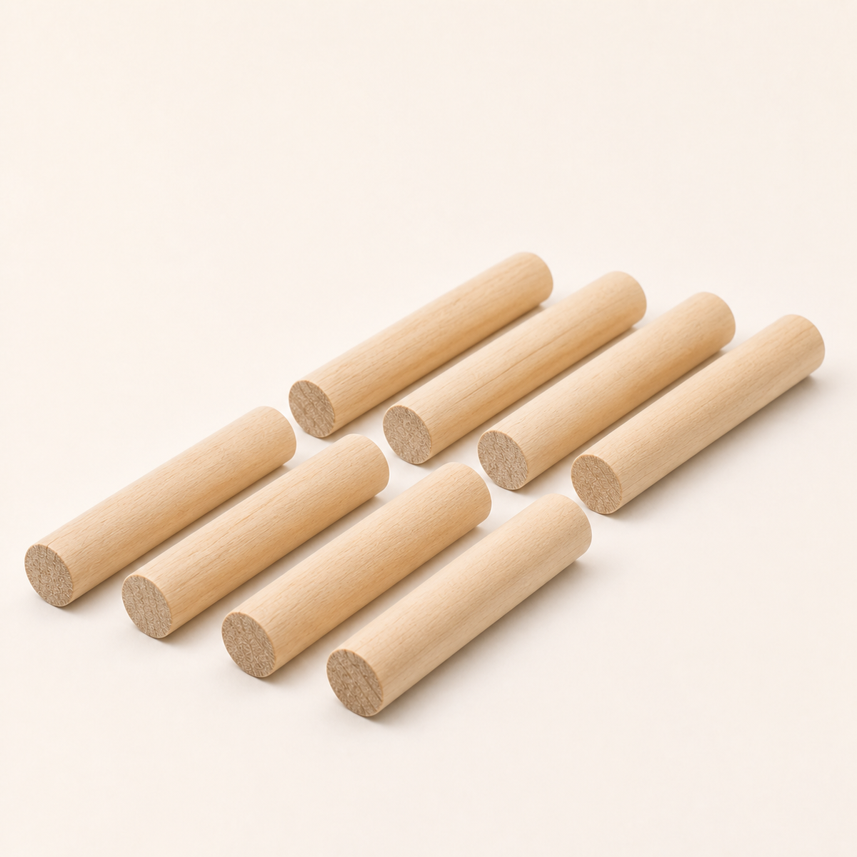 Eight solid wood pegboard dowels 15 mm diameter by 11.5 cm long on a white background