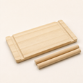 Solid pine pegboard shelf 10 x 20 cm shown with two wooden dowels on a white background