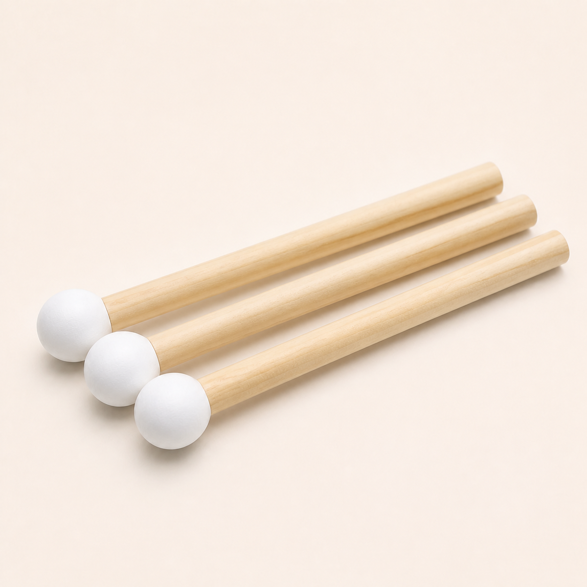 Three white wooden matchstick pegs 20 mm by 14.5 cm on a white background